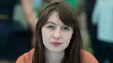 The acclaimed novelist declares she is unable to travel to the UK because of legal concerns